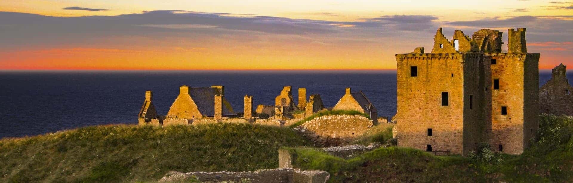 Dunnottar castle bathed in the light of a spectacular sunset