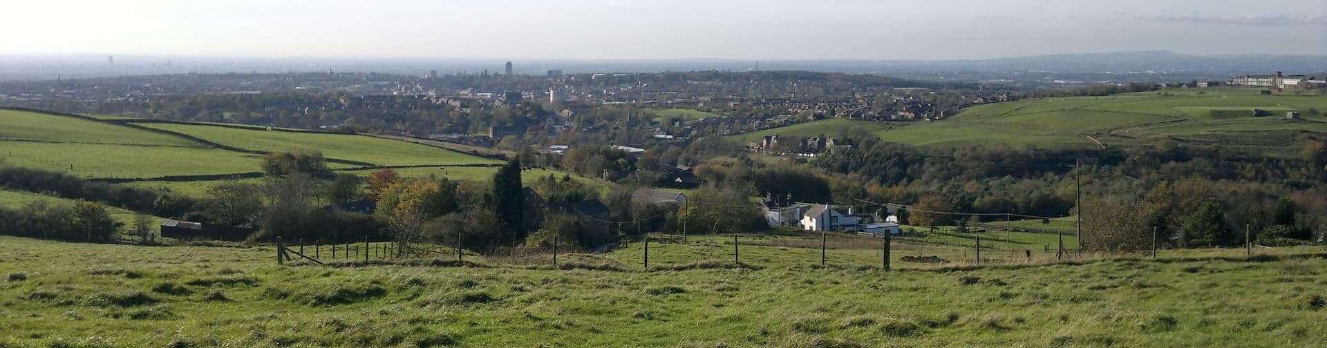 A view of Oldham, Greater Manchester, and beyond, as seen from Brighton Road in the Strinesdale area of Oldham, in Greater Manchester, England. This outyling part of Oldham is rural and borders on to the parish of Saddleworth. Photo: Steven Haslington