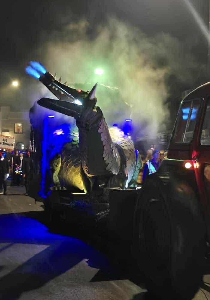 A photo of a mechanical fire-breathing dragon in the Rye firework pageant.